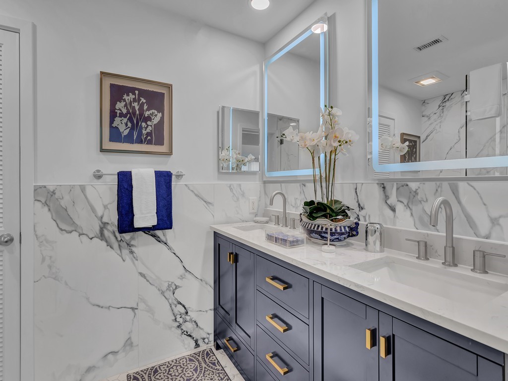 1155 Reef Road, Unit B2 Vero Beach, FL 32963 - Photo 17 of 32 a bathroom with a sink and a mirror