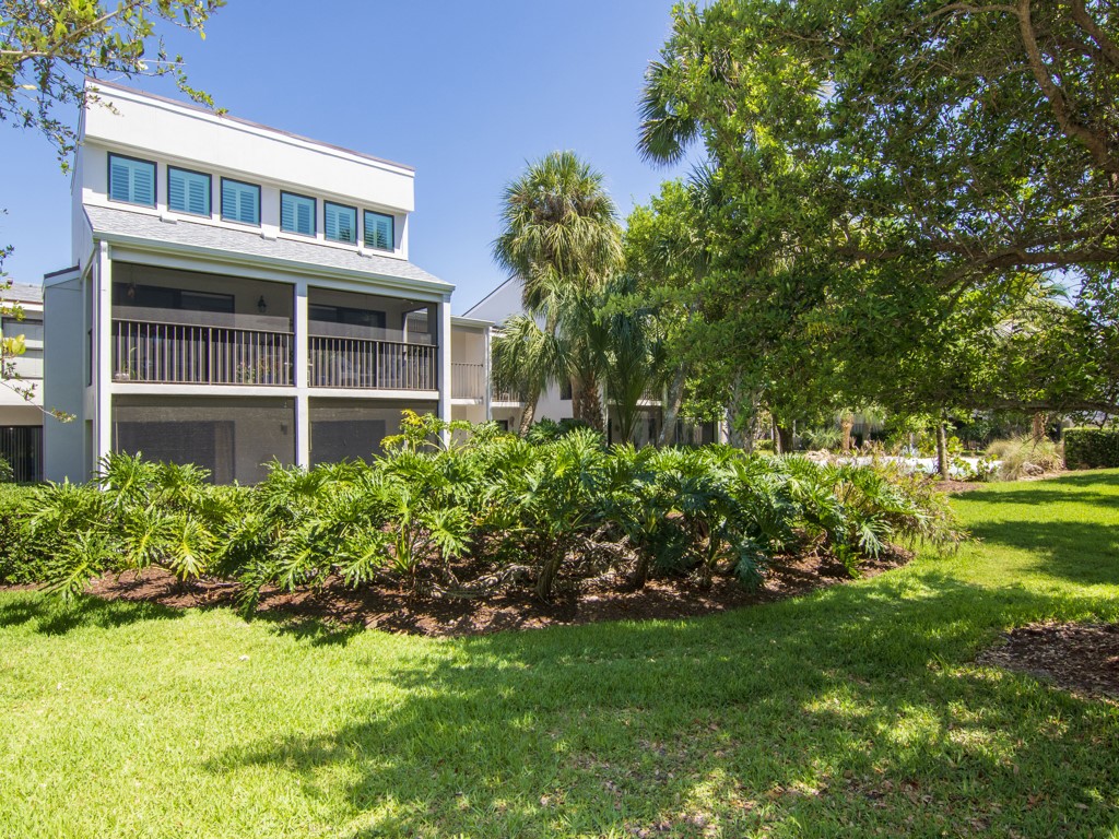 1155 Reef Road, Unit B2 Vero Beach, FL 32963 - Photo 24 of 32 a front view of a house with a yard
