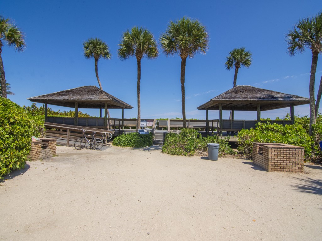 1155 Reef Road, Unit B2 Vero Beach, FL 32963 - Photo 27 of 32 an outdoor space with furniture and umbrella