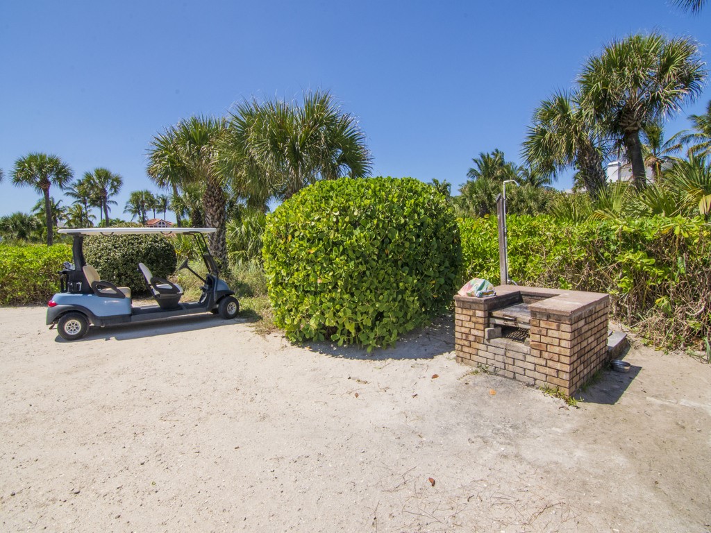 1155 Reef Road, Unit B2 Vero Beach, FL 32963 - Photo 28 of 32 a wooden bench sitting in the middle of a field