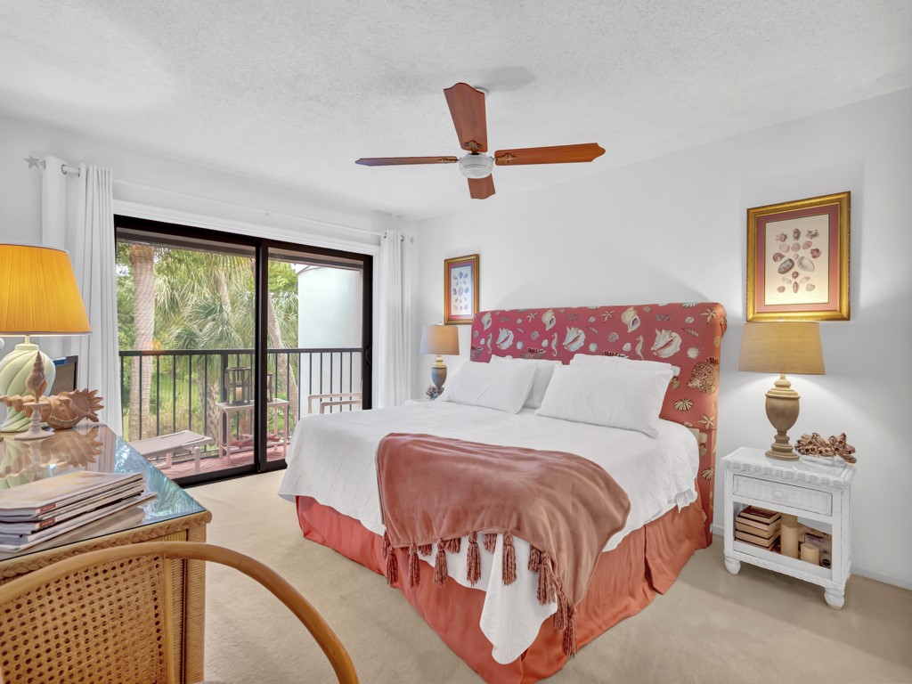 1155 Reef Road, Unit B2 Vero Beach, FL 32963 - Photo 9 of 32 a spacious bedroom with a bed and a large window