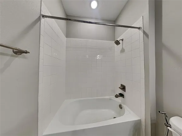 a close view of a bathtub in bathroom