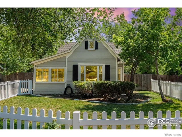 a front view of house with a garden