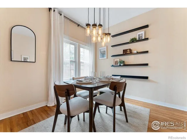 a view of a dining room with furniture and window