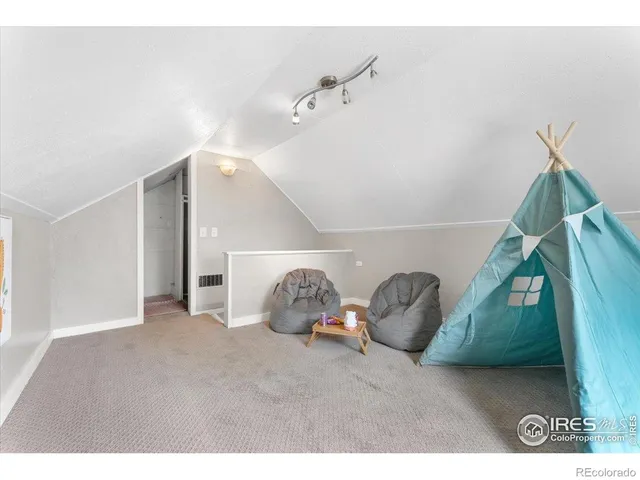 a view of a big room with windows