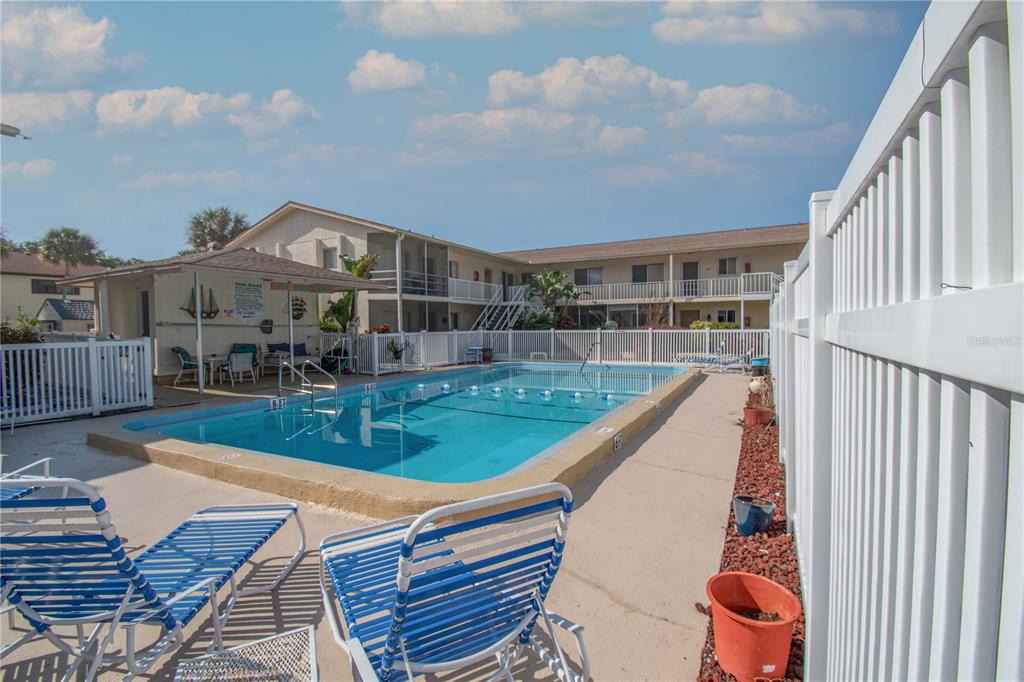 340 Base Avenue East, Unit 314 Venice, FL 34285 - Photo 1 of 1 a view of house with swimming pool outdoor seating