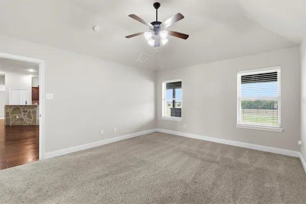 a view of an empty room with a window