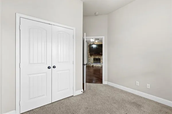 an empty room with furniture wooden floor and window