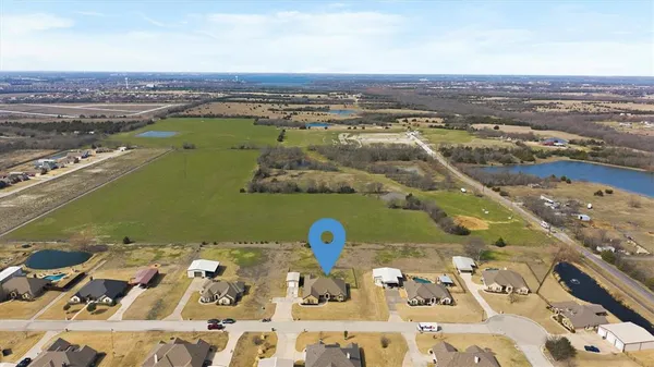 an aerial view of a city with ocean view