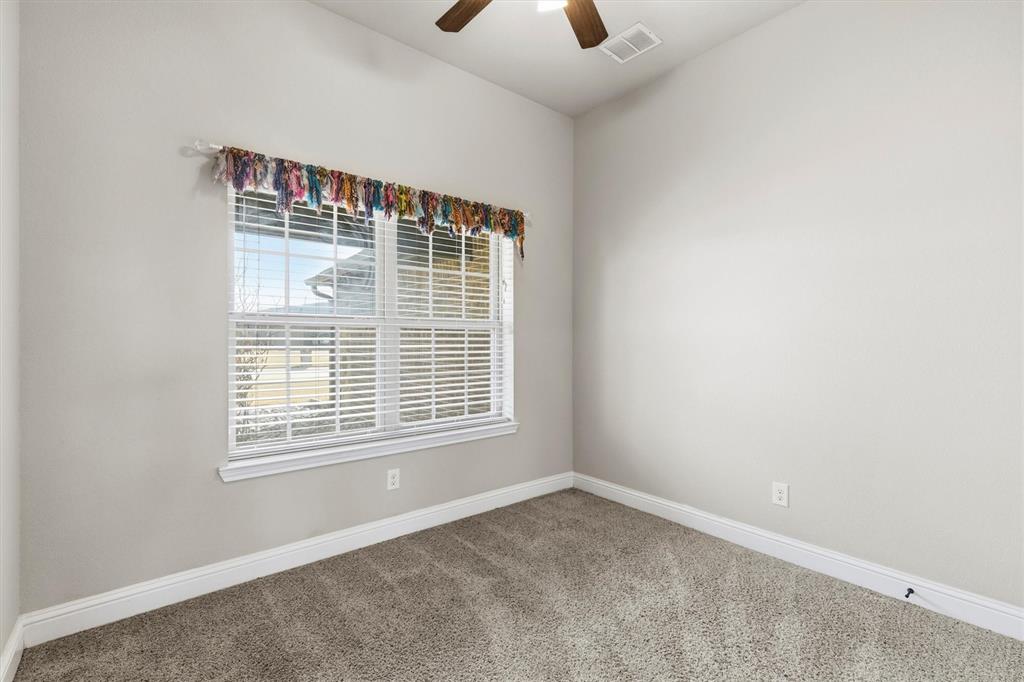 505 Water Fall Lane Nevada, TX 75173 - Photo 22 of 36 a view of an empty room with a window