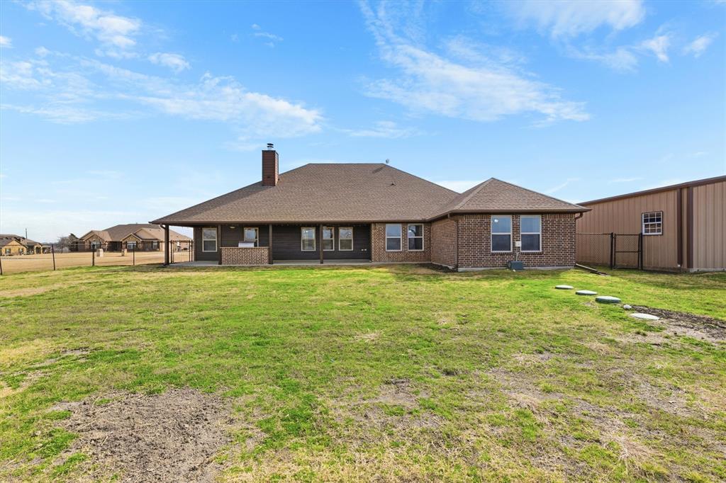505 Water Fall Lane Nevada, TX 75173 - Photo 30 of 36 a front view of a house with garden