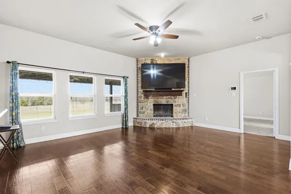 a view of livingroom with hardwood floor and ceiling fan