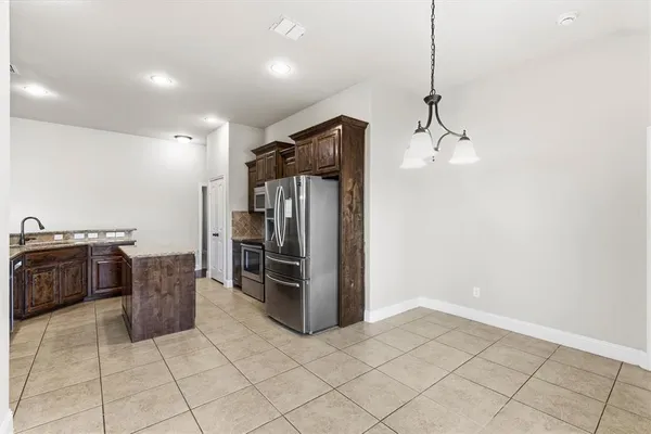 a living room with furniture and a ceiling fan