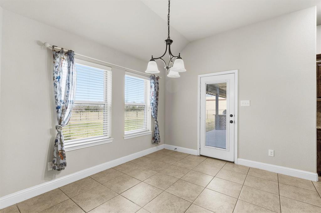 505 Water Fall Lane Nevada, TX 75173 - Photo 10 of 36 a view of an empty room with a window
