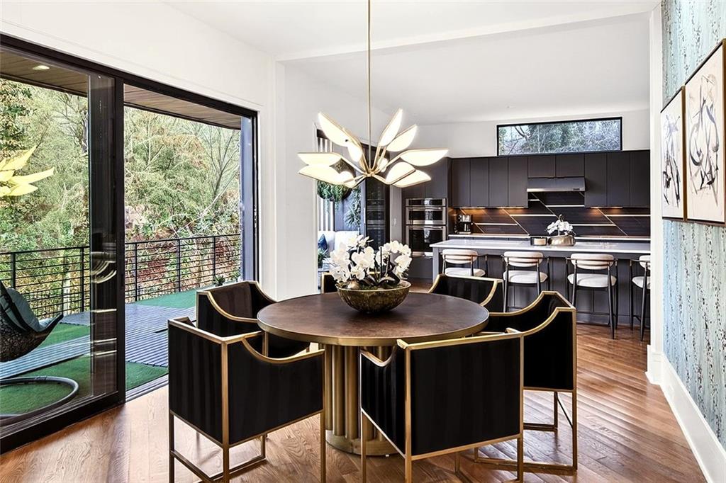345 Pinecrest Road Northeast Atlanta, GA 30342 - Photo 18 of 70 a dining room with furniture and wooden floor