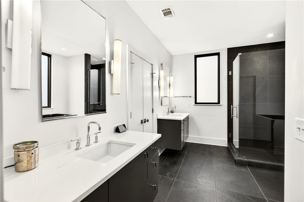 345 Pinecrest Road Northeast Atlanta, GA 30342 - Photo 39 of 70 a bathroom with a double vanity sink mirror and double