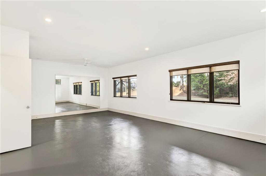 345 Pinecrest Road Northeast Atlanta, GA 30342 - Photo 47 of 70 a view of an empty room with wooden floor and a window