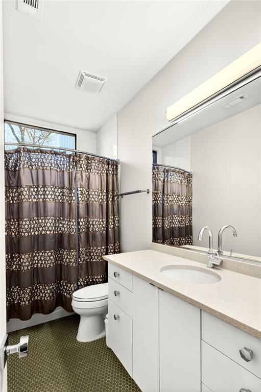 345 Pinecrest Road Northeast Atlanta, GA 30342 - Photo 48 of 70 a bathroom with a sink toilet and shower
