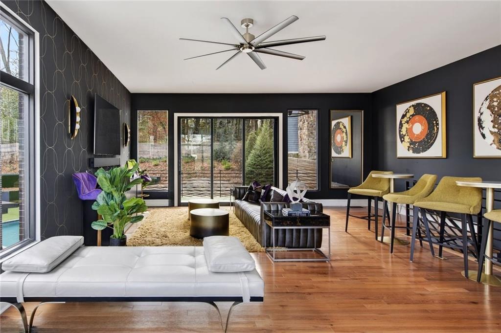 345 Pinecrest Road Northeast Atlanta, GA 30342 - Photo 58 of 70 a living room with furniture and floor to ceiling windows