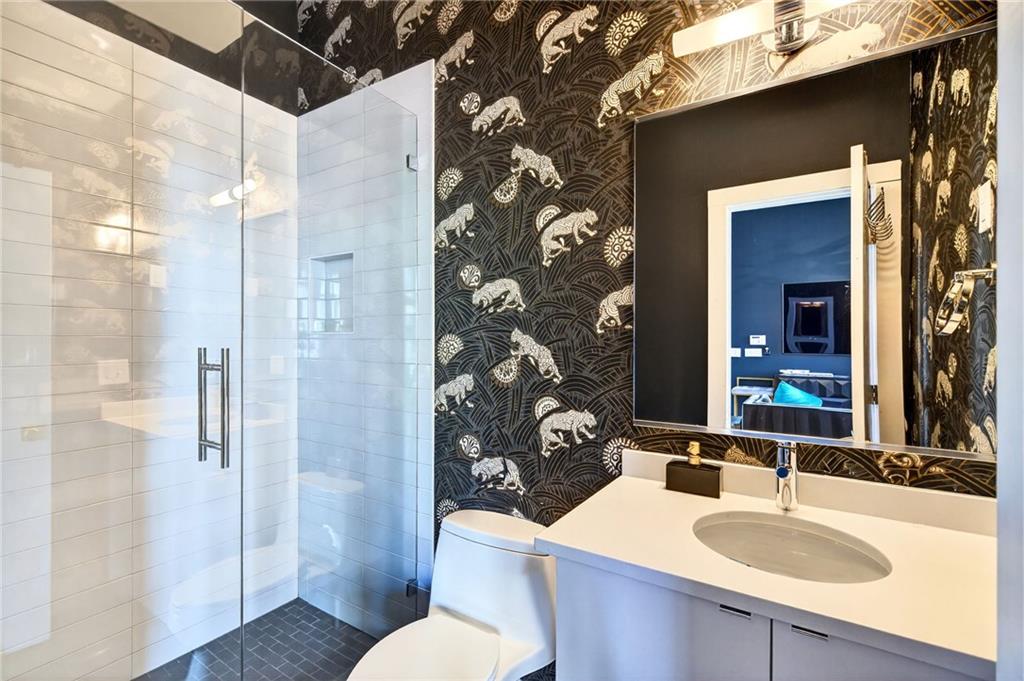345 Pinecrest Road Northeast Atlanta, GA 30342 - Photo 61 of 70 a bathroom with a sink and mirror with toilet