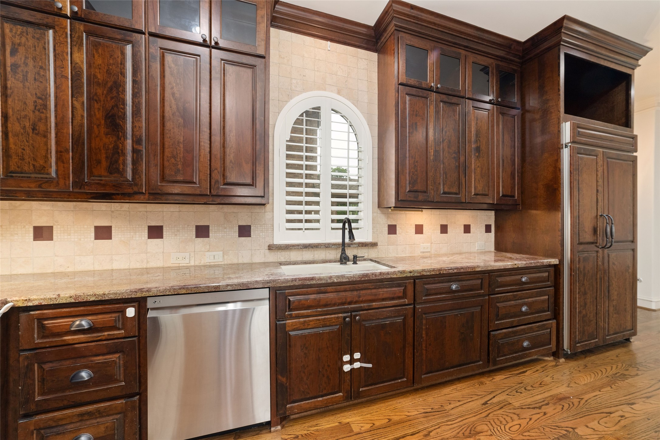 4102 Gramercy Street Houston, TX 77025 - Photo 11 of 35 a kitchen with granite countertop a sink cabinets and stainless steel appliances