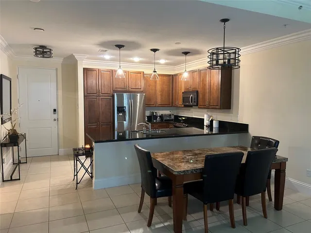 a kitchen with a table and chairs in it