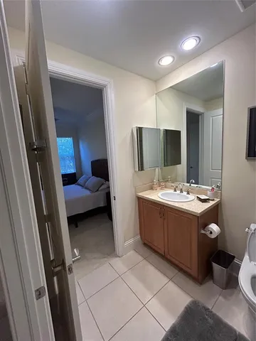 a spacious bedroom with a bed and a window