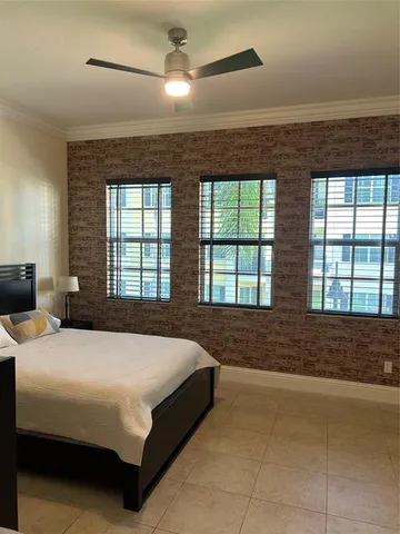 a bedroom with a bed and lamp with