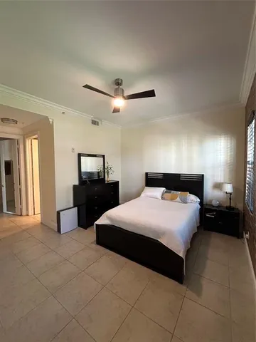 a bathroom with a granite countertop sink a toilet and bathtub
