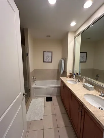 a view of walk in closet with clothes