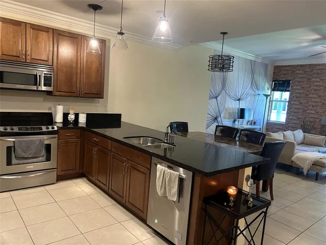 a kitchen with a table and chairs in it