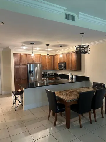 a work room with furniture and a window