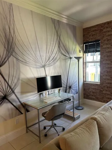 a kitchen with kitchen island granite countertop a refrigerator a stove and a sink