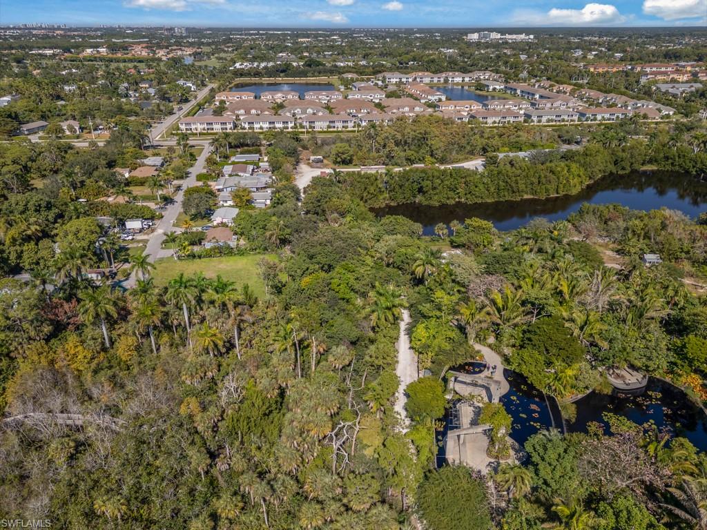 4975 Palmetto Court Naples, FL 34112 - Photo 14 of 18 an aerial view of residential houses with outdoor space