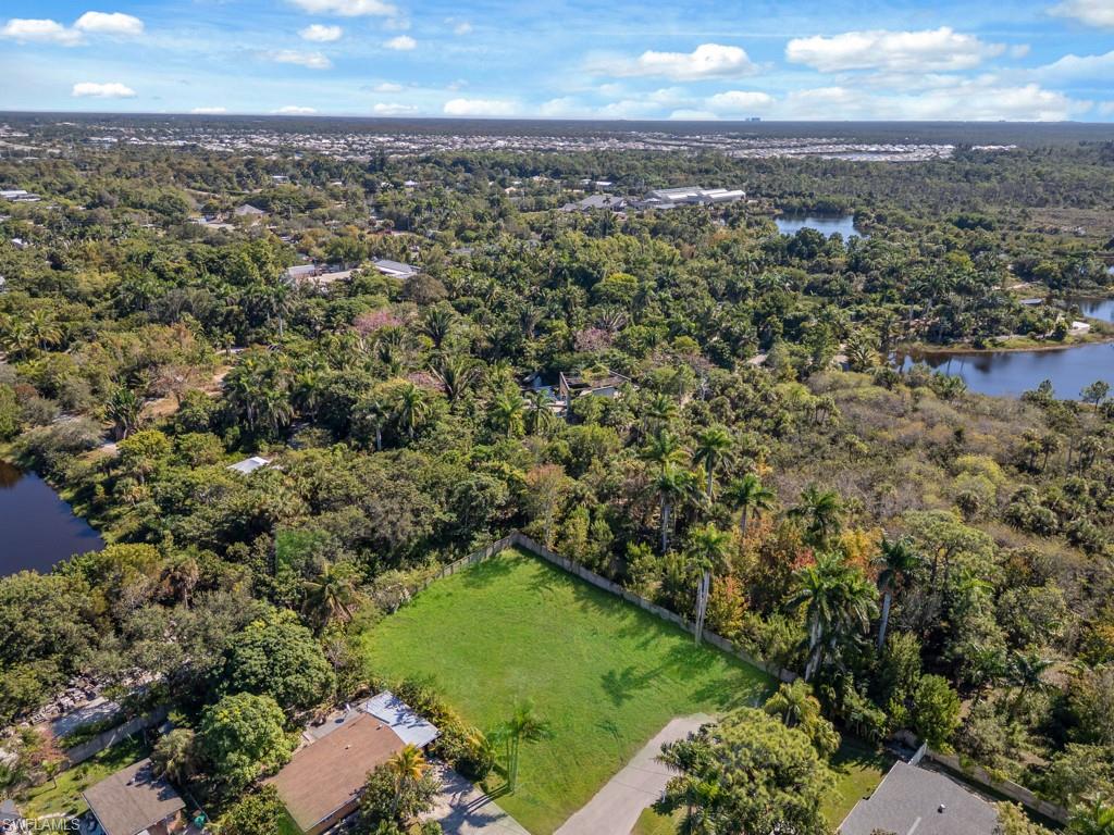 4975 Palmetto Court Naples, FL 34112 - Photo 15 of 18 an aerial view of residential houses with outdoor space and trees