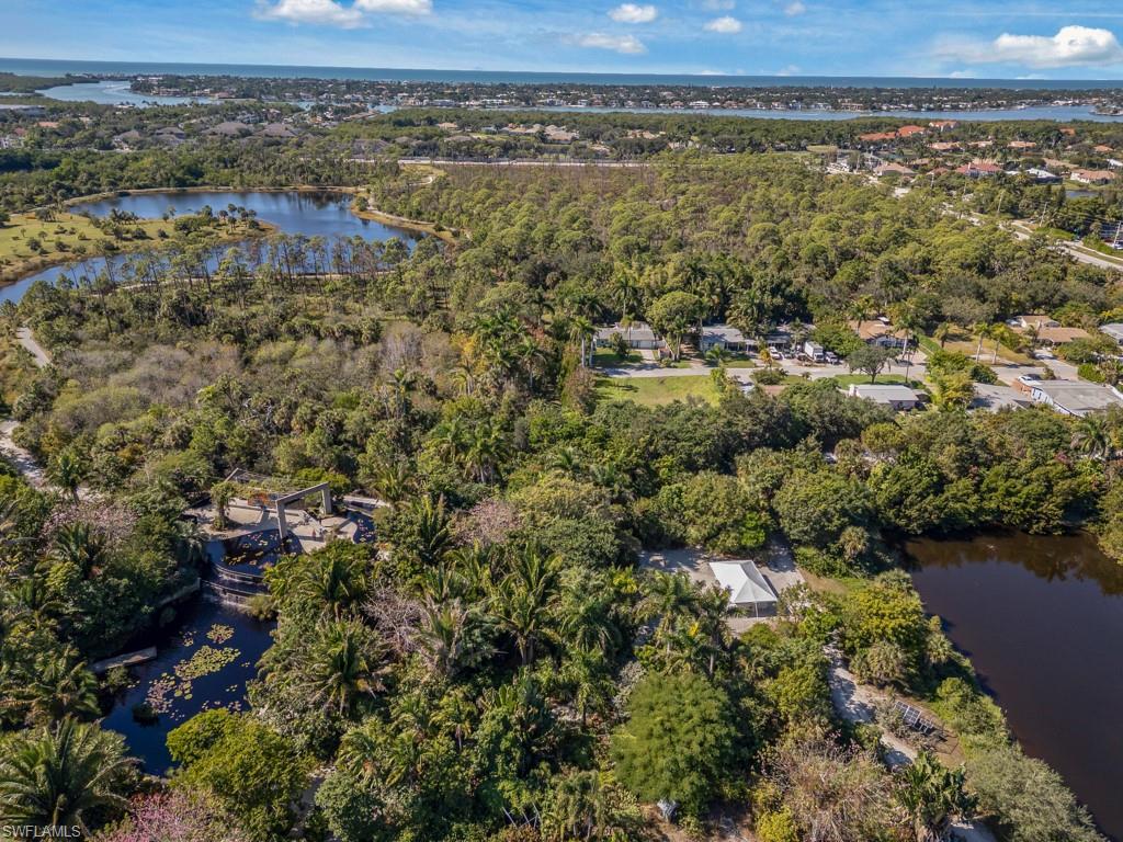 4975 Palmetto Court Naples, FL 34112 - Photo 17 of 18 an aerial view of residential houses with outdoor space and trees