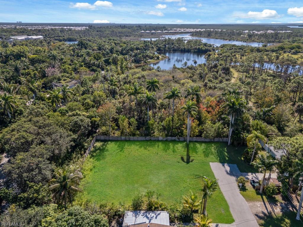 4975 Palmetto Court Naples, FL 34112 - Photo 8 of 18 an aerial view of a houses with a yard