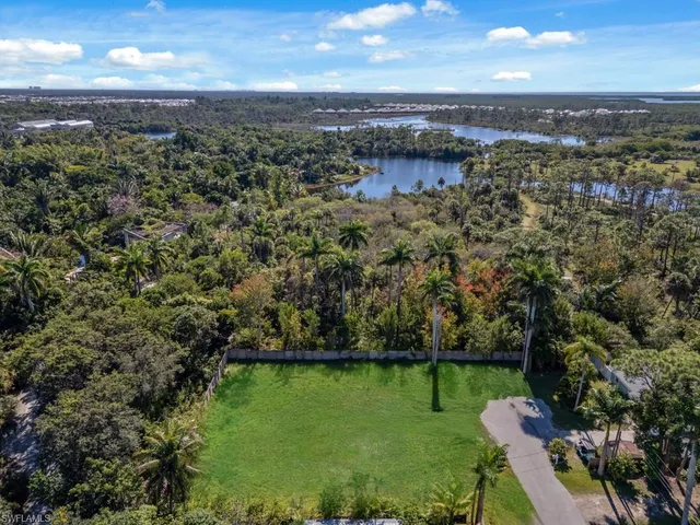 an aerial view of a houses with a yard