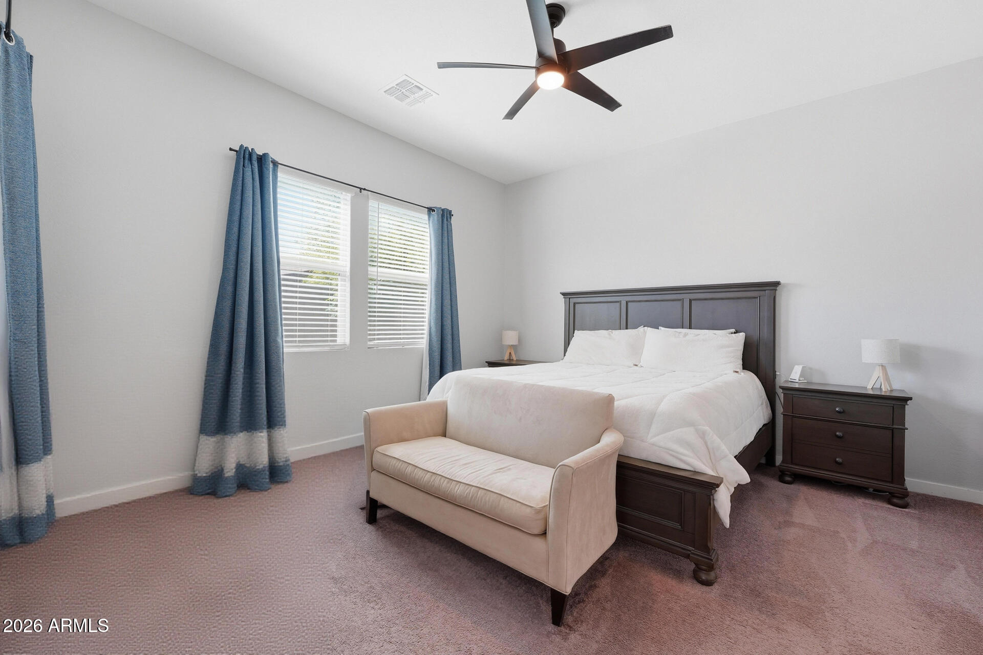 23069 East Mayberry Road Queen Creek, AZ 85142 - Photo 17 of 48 a spacious bedroom with a bed and a window
