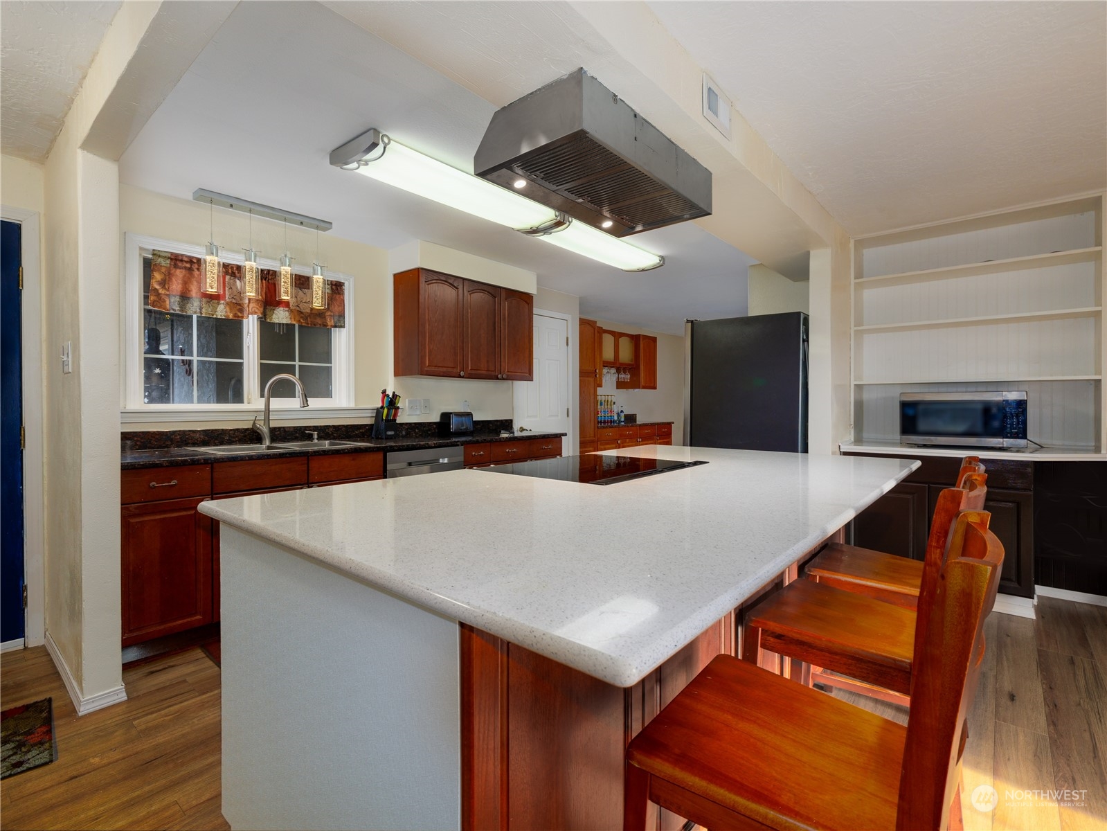 136 Galaxie Road Chehalis, WA 98532 - Photo 8 of 27 a kitchen with stainless steel appliances granite countertop a sink a stove and a refrigerator