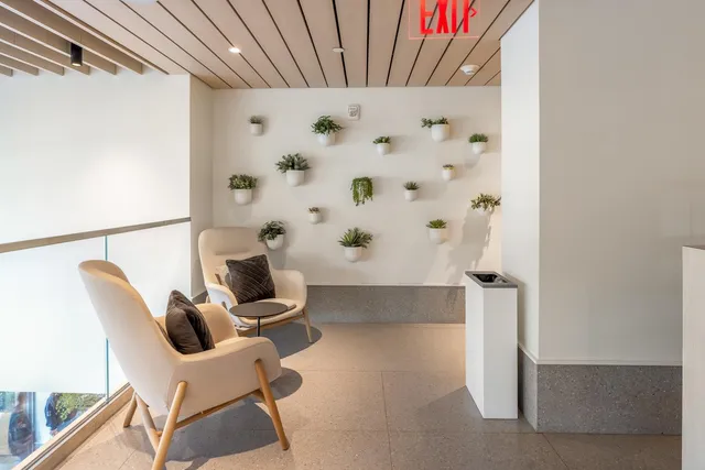 a view of kitchen with furniture and refrigerator