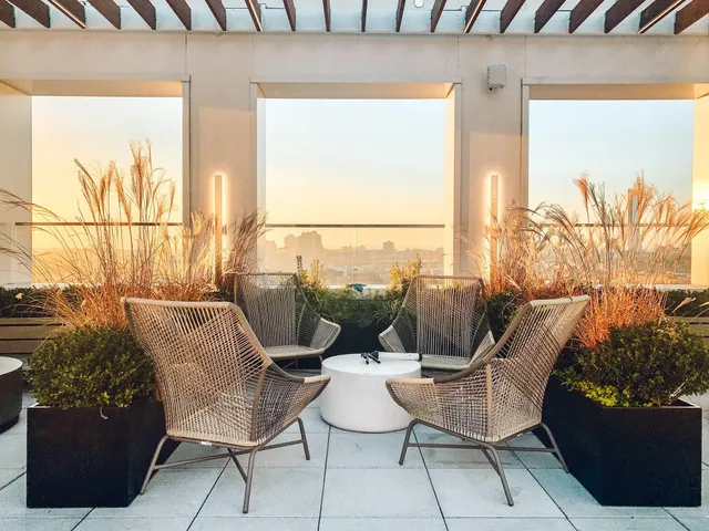 a couple of chairs sitting in front of a window