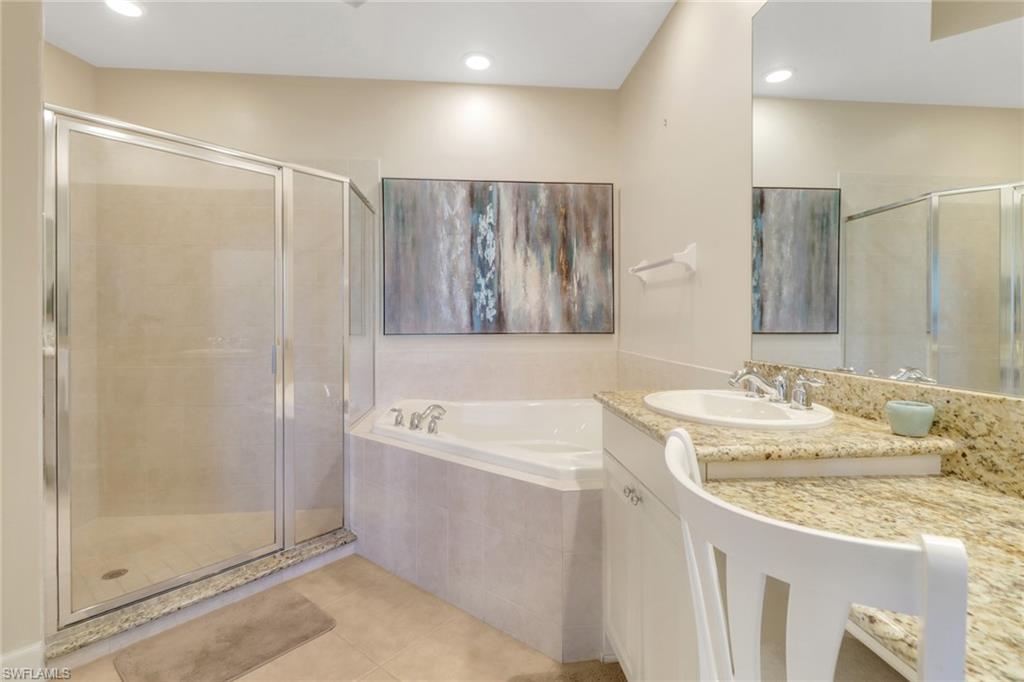 9208 Quartz Lane, Unit 102 Naples, FL 34120 - Photo 15 of 31 a bathroom with a sink and a mirror