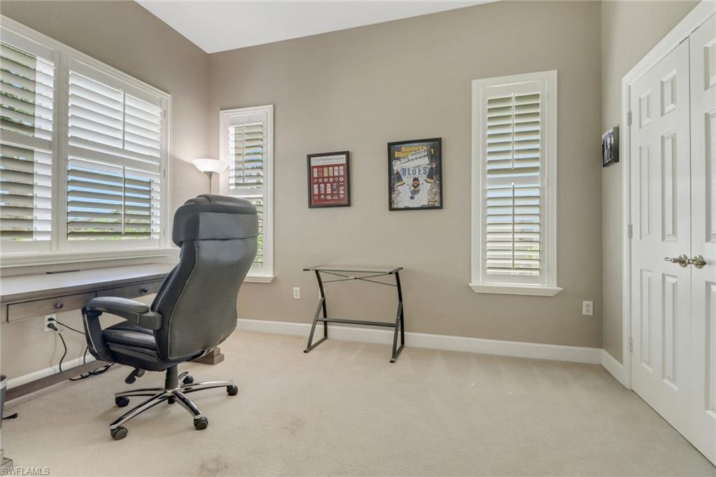 9208 Quartz Lane, Unit 102 Naples, FL 34120 - Photo 19 of 31 a view of a workspace with a window and a chair