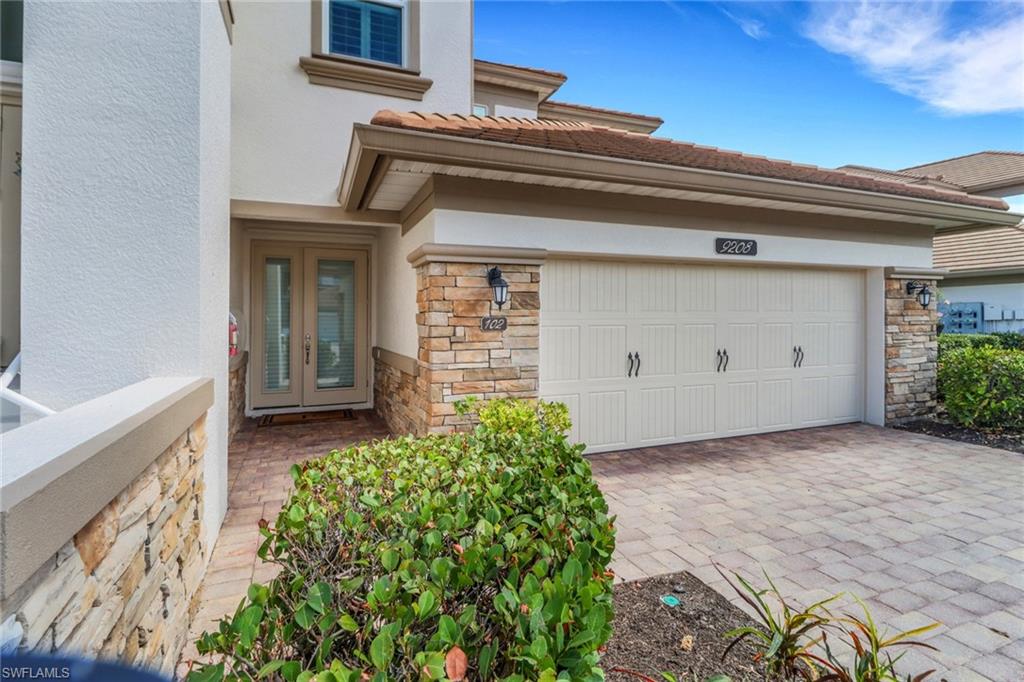 9208 Quartz Lane, Unit 102 Naples, FL 34120 - Photo 2 of 31 a view of an entrance of the house