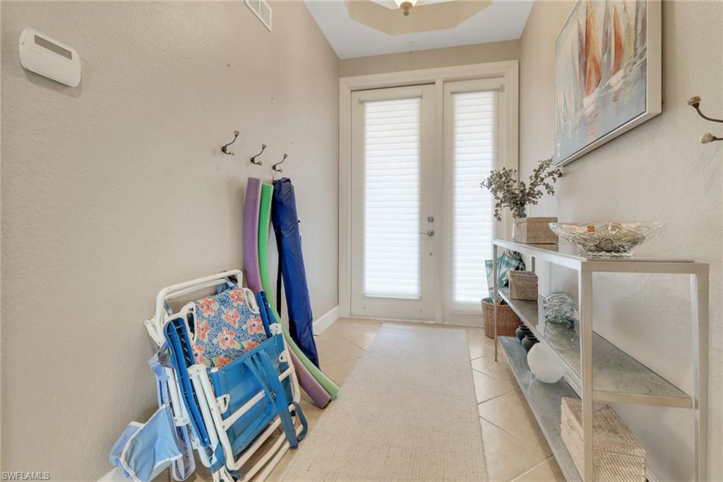 9208 Quartz Lane, Unit 102 Naples, FL 34120 - Photo 24 of 31 a view of a room with gym equipment