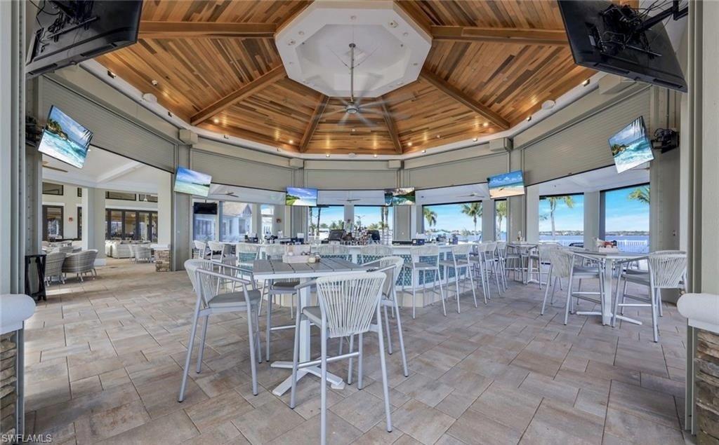 9208 Quartz Lane, Unit 102 Naples, FL 34120 - Photo 29 of 31 a view of a bar restaurant
