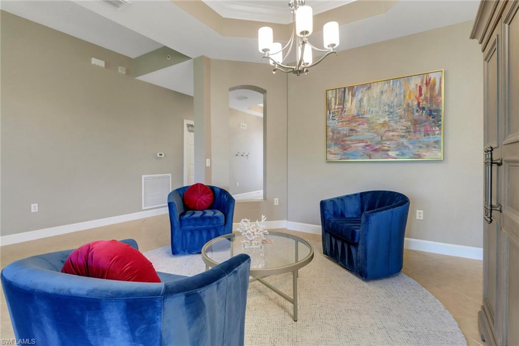 9208 Quartz Lane, Unit 102 Naples, FL 34120 - Photo 5 of 31 a living room with furniture and decor