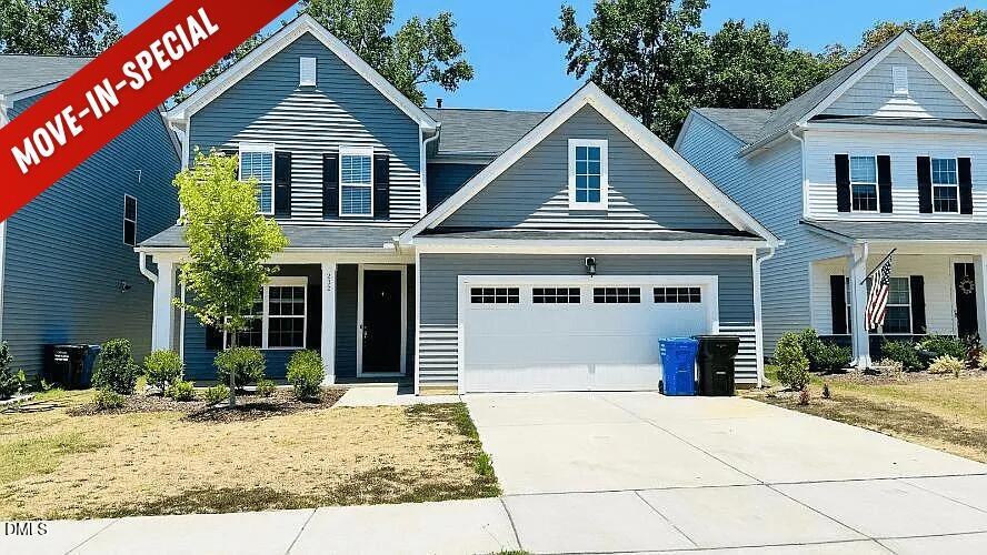 232 Chateau Way Angier, NC 27501 - Photo 1 of 23 a front view of a house with garden