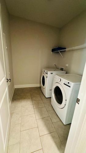 232 Chateau Way Angier, NC 27501 - Photo 13 of 23 a utility room with dryer and washer